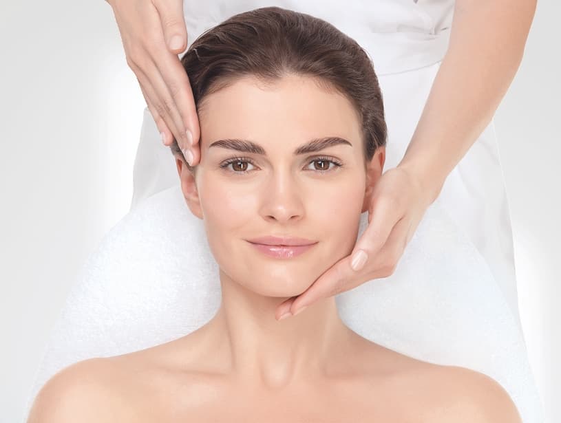 A woman receiving the Age Summum facial at The Zen Den, designed to smooth fine lines and restore radiance.