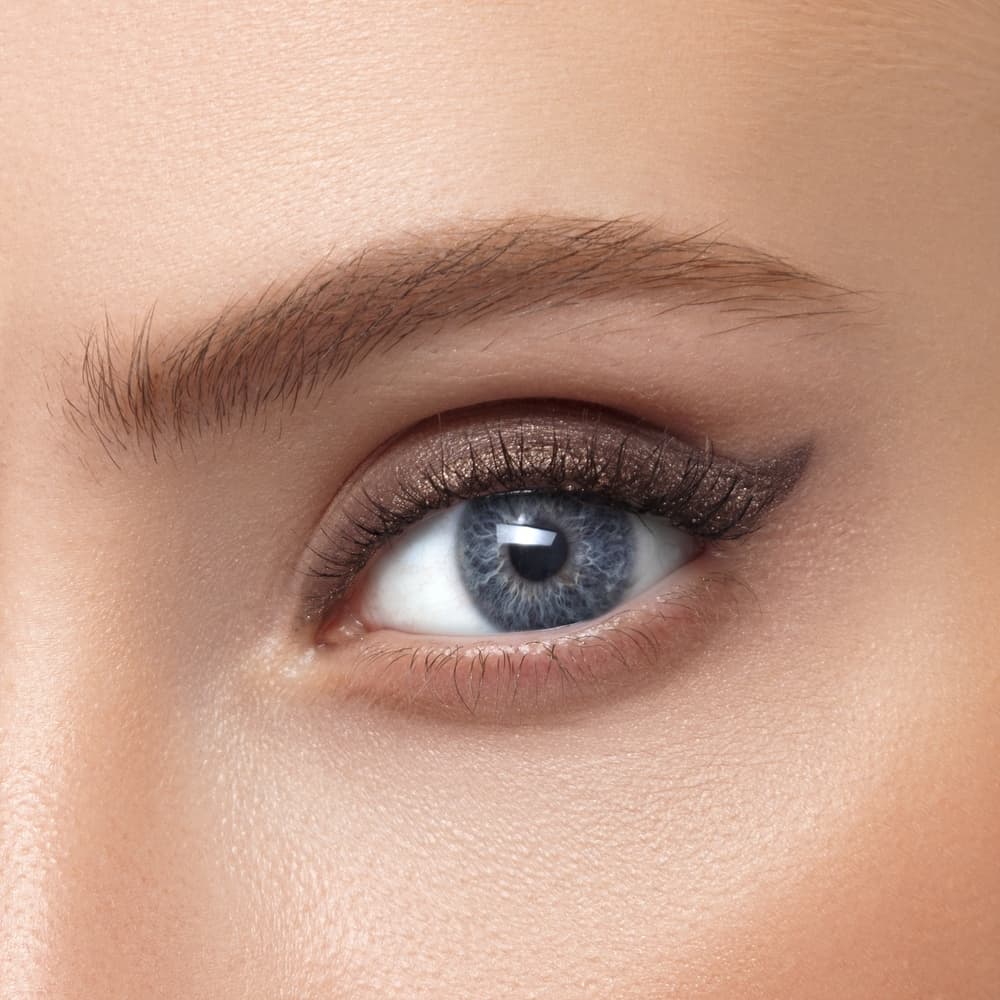 Close-up of a perfectly shaped and defined eyebrow with soft, natural makeup, showcasing the results of a Definition Brows treatment at The Zen Den.