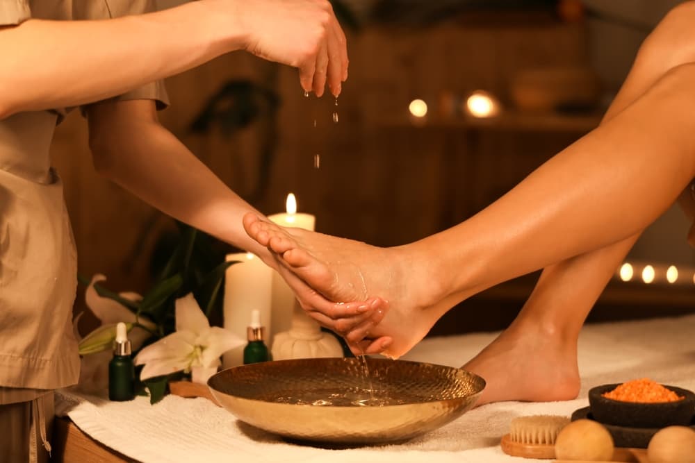 Relaxing foot spa treatment at The Zen Den with warm water, essential oils, and gentle care to soothe and refresh tired feet.