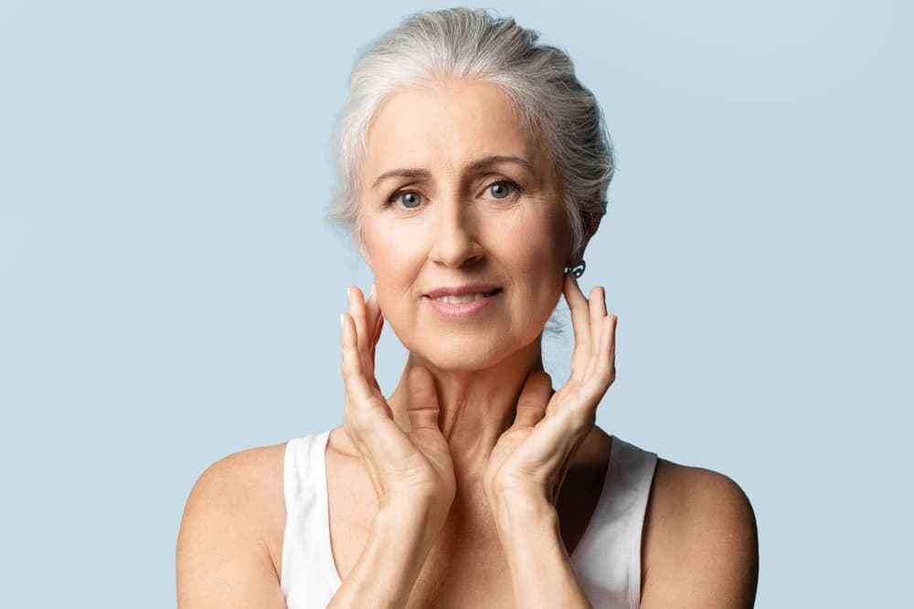 A mature woman with soft, radiant skin after a Hydra Summum facial at The Zen Den, designed to deeply hydrate and restore youthful glow.
