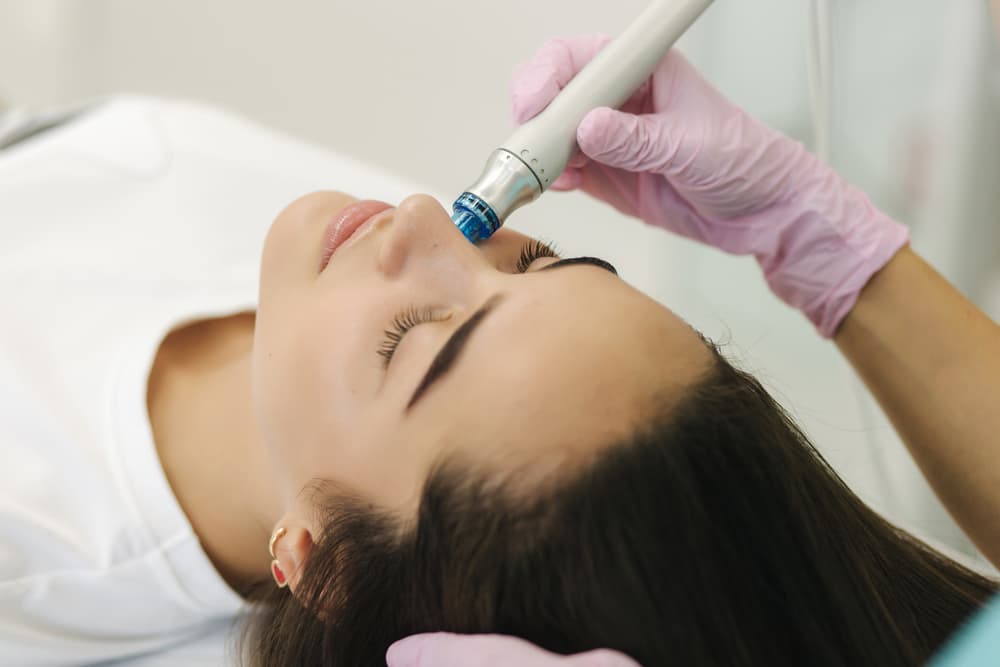 A client receiving the HydrO2 Clear Skin facial at The Zen Den, targeting congestion and promoting a clearer, healthier complexion.