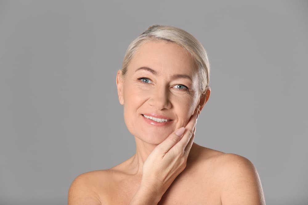A woman with radiant, youthful skin after the HydrO2 Time Defence Facial at The Zen Den, designed to reduce signs of ageing and boost skin firmness.