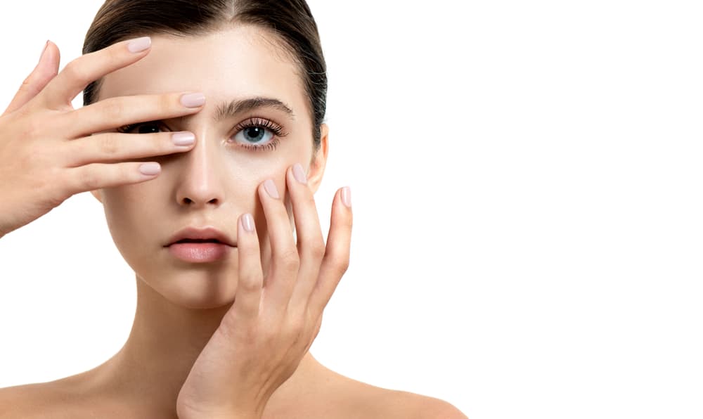 Close-up of a woman with well-groomed brows and natural makeup, representing lamination, tinting, and waxing at The Zen Den, Glasgow.