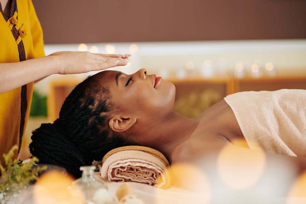 Reiki and facial massage at The Zen Den, combining gentle energy healing with soothing facial techniques for deep relaxation and balance.