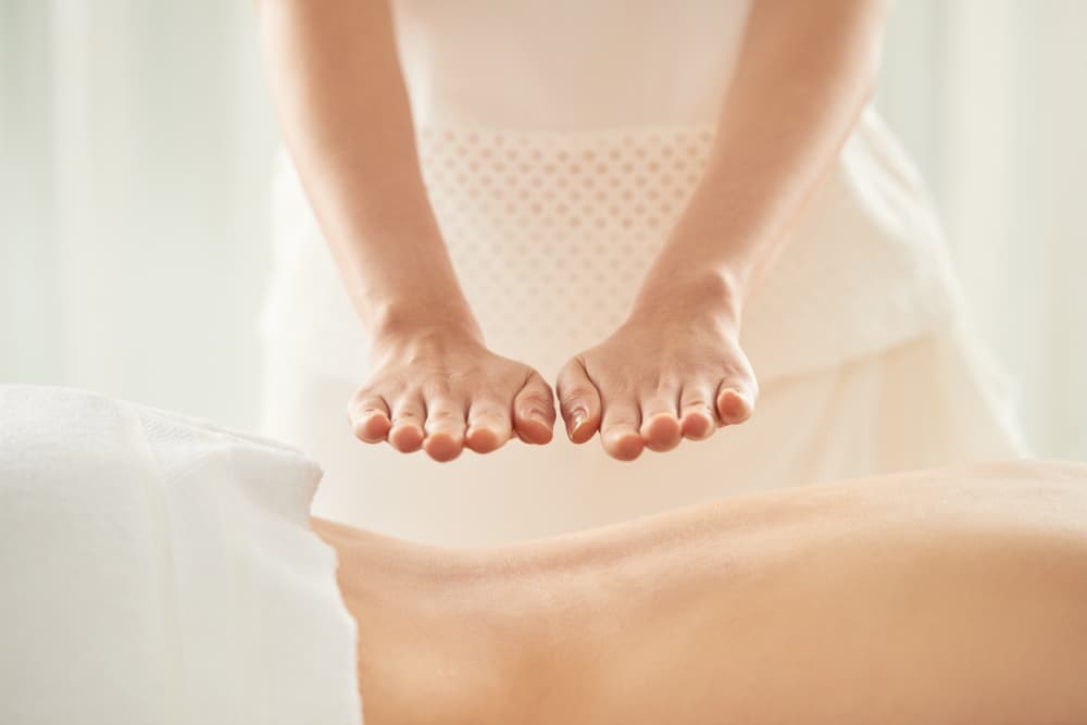 Reiki back massage at The Zen Den, blending energy healing with soothing massage for deep relaxation and balance.