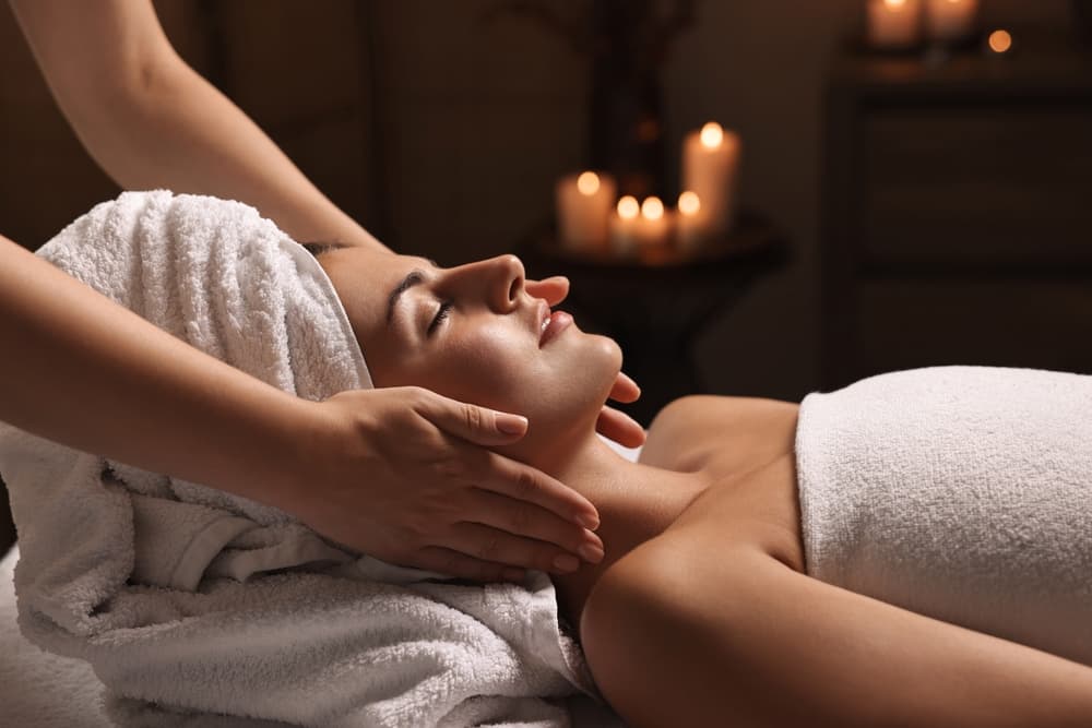 Reiki Balance and Reset master level treatment at The Zen Den, providing deep energy healing and stress relief in a warm candlelit setting.
