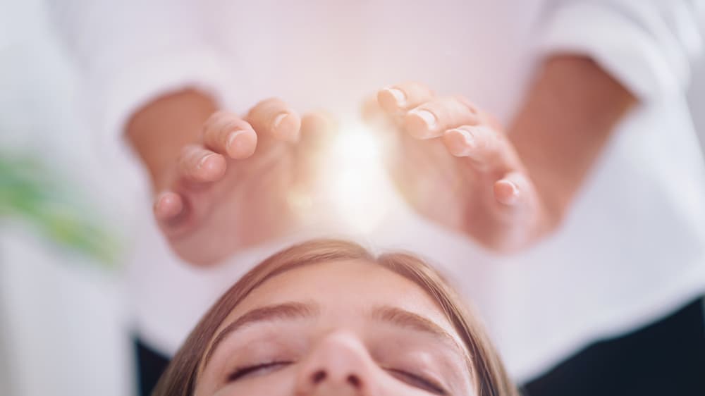 Reiki re-alignment and attunement session at The Zen Den, focusing on restoring energy flow and inner balance.